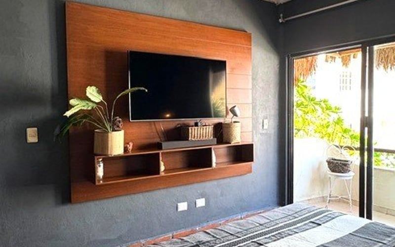 Bedroom TV wall with balcony
