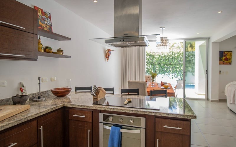 Kitchen island with dining area beyond