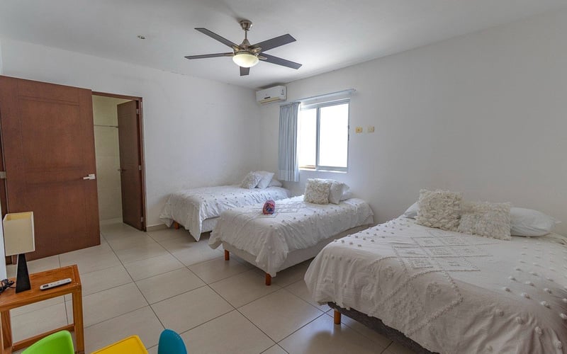 Bedroom with two beds and wardrobe