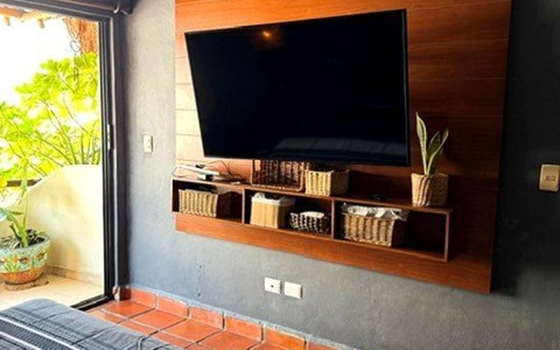 Bedroom TV wall with balcony view