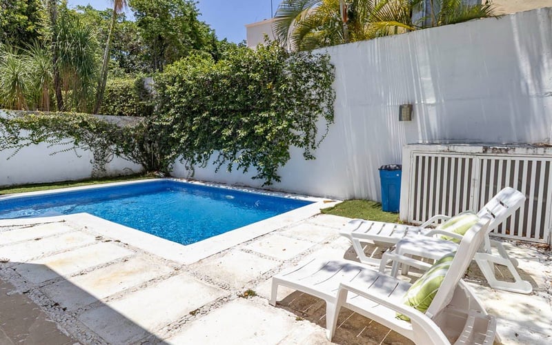 Pool with sun loungers