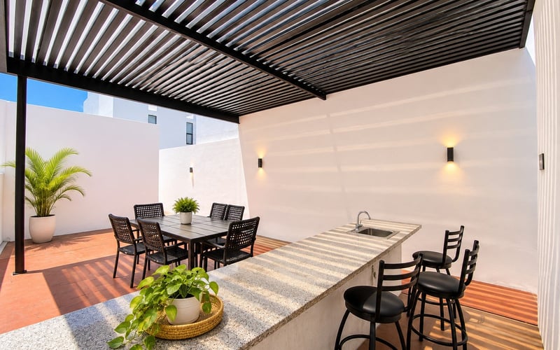 Outdoor dining area with pergola and bar